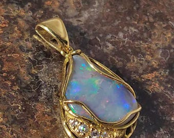 Australian Black Fire Opal Pendant in solid 18 carat gold set with 4 brilliant cut diamonds