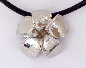 Frangipani Blossom Pendant set with diamond Dew Drop in 18 k white gold.