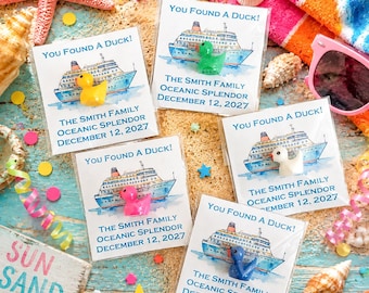 May include: Five clear plastic pouches each containing a small rubber duck in yellow, green, white, pink, or blue. Each pouch features a printed watercolor illustration of a cruise ship and the text: You Found A Duck! The Smith Family Oceanic Splendor December 12, 2027.