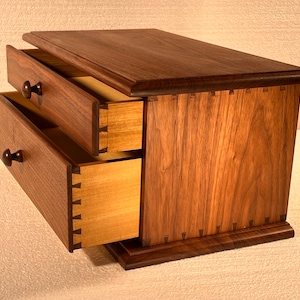 Nice little walnut chest of drawers.