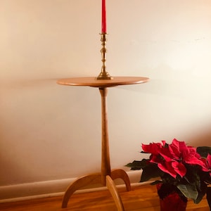 Shaker candle stand with quartersawn cherry top. Lightweight…easily moved to an area that needs illumination.