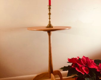 Shaker candle stand with quartersawn cherry top. Reproduction of the lightweight and mobile accent table.