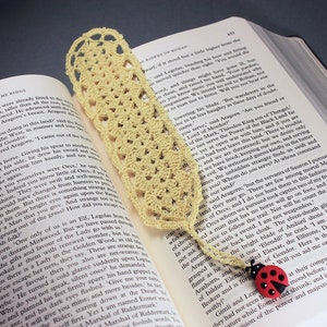 A lovely light yellow crocheted bookmark with a ladybug attached. This bookmark's little ladybug will help you keep your place and give you a smile. Great for gift giving or for yourself. Perfect for the reader in your life.