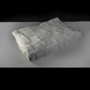 May include: A gray knitted throw blanket with a checkered pattern.