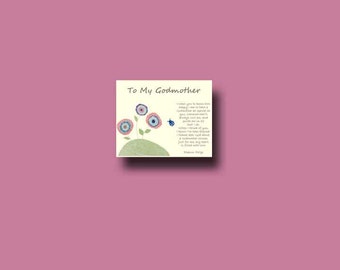 May include: A greeting card with the text "To My Godmother" and a poem. The card features a whimsical illustration of three colourful flowers with blue and red accents, and a small blue ladybug. The background is a solid pink colour.