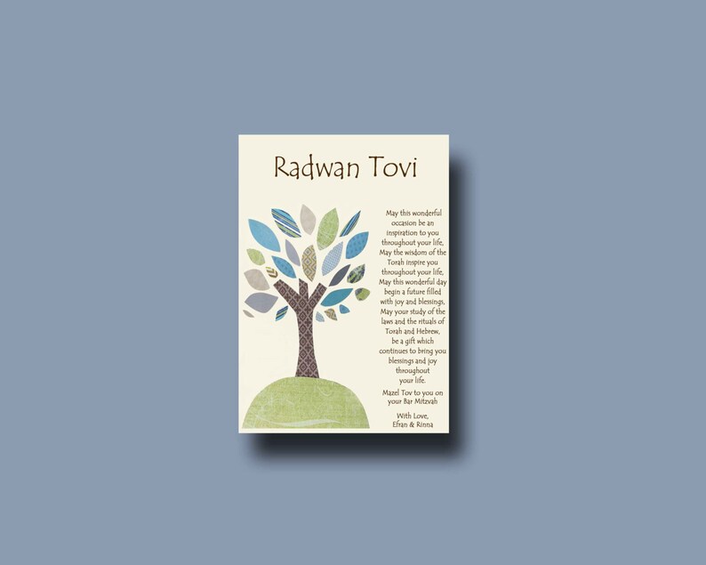 May include: A card with a blue and green tree design and the text "Radwan Tovi" at the top. The card has a message wishing the recipient a happy Bar Mitzvah and a future filled with joy and blessings. The card is signed "With Love, Ethan & Ronit."