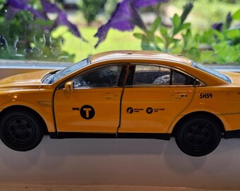 Die Cast Welly NYC Taxi Roll Back Model Car