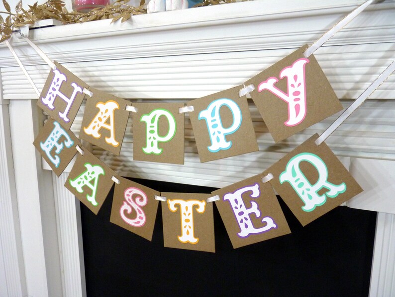 May include: A festive banner spelling "HAPPY EASTER" with colorful letters on brown square cards. The letters are outlined in various colors, including pink, green, and blue, and are strung together with white ribbon, perfect for Easter decorations.