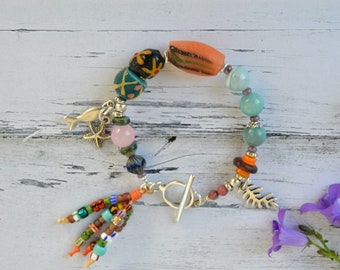 Eclectic bracelet with African trade bead and naural stone, mixed media jewelry for  women with fish & starfish charm, boho spanish jewelry,