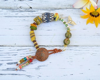 Eclectic bead bracelet with whale tail, wishbone charm and African  beads, mixed media jewelry, Unique button bracelets, spanish jewelry