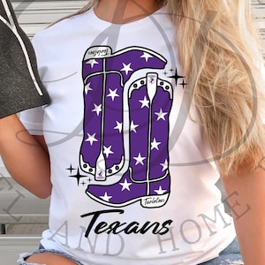May include: White t-shirt with a purple and white cowboy boot design. The boots have white stars on them. The text "Texans" is written below the boots. The text "Taylor" is written on the bottom of the boot.