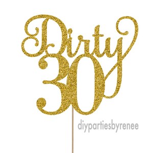 May include: Gold glitter cake topper with the words "Dirty 30" in a cursive font.