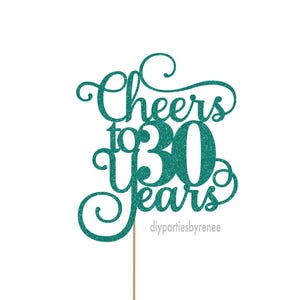 May include: Teal glitter cake topper with the text "Cheers to 30 Years".