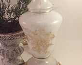 white opalescent vintage glass vanity lamp gold floral motif banding on a brass tone base