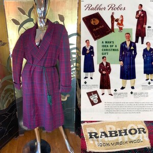May include: A red and black plaid robe with a green tassel tie. The robe is made of 100% virgin wool. The label reads "Rabhor Robes".