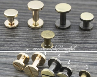 May include: Assortment of ten brass and black metal screw-on post studs. The studs are arranged in two rows, with the larger studs in the top row and the smaller studs in the bottom row. The studs are all made of metal and have a shiny finish.