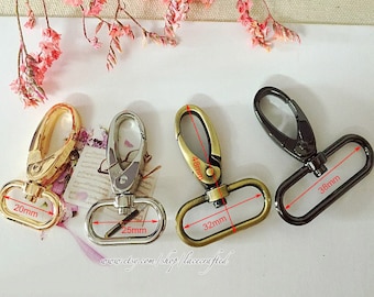 May include: Four metal swivel clasps in different sizes and finishes. The clasps are 20mm, 25mm, 32mm, and 38mm in length. The clasps are gold, silver, and black.