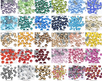 May include: Assortment of 40 different colors of rhinestones, each color is displayed in a separate square. The rhinestones are arranged in a grid pattern. Each square has a number and a name for the color of the rhinestones.