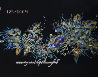 May include: A large peacock feather design applique with gold and blue sequins. The applique measures 125 inches by 60 inches.