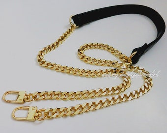 May include: A gold chain strap with two clasps and a black leather strap. The chain is a curb chain style.