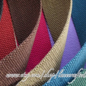 May include: A variety of woven cotton webbing in different colors, including black, red, brown, beige, purple, teal, green, and yellow. The webbing is arranged in a fan shape, with the ends of each strip overlapping. The text "www.etsy.com/shop/lacecrafted" is visible at the bottom of the image.
