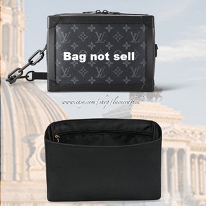 May include: A black and grey Louis Vuitton monogrammed crossbody bag with a chain strap. The bag has a zipper closure and a black lining. The text "Bag not sell" is printed on the front of the bag.