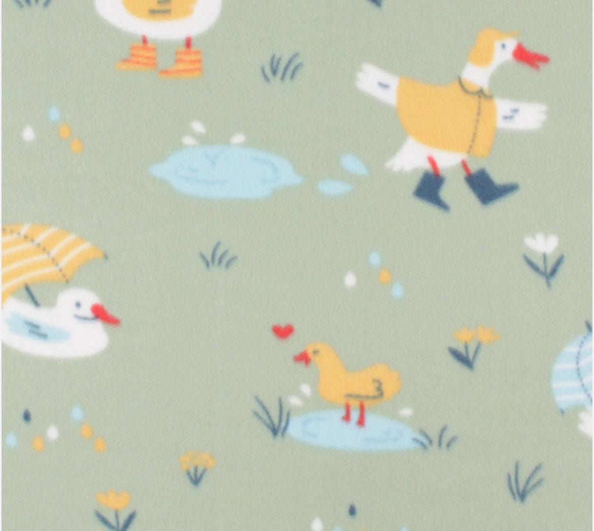 Raincoat Ducks on Green -  Blizzard Fleece Fabric
