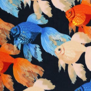 May include: A black background with a repeating pattern of colorful goldfish. The fish are orange, white, and blue with black markings. The fish are swimming in different directions.