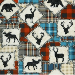 May include: A patchwork fabric with a repeating pattern of deer, moose, and bears in a black silhouette. The fabric features a red, blue, and white plaid pattern.