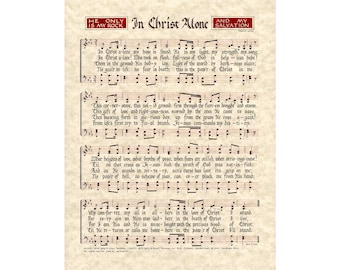 May include: Sheet music print of the hymn "In Christ Alone" with musical notes and lyrics. The text is in black ink on a cream-colored background. The title and other text are in red.