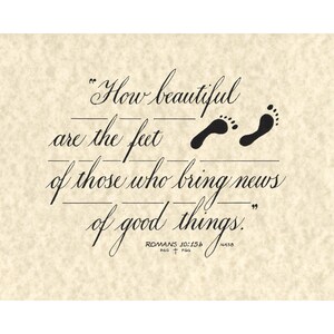 May include: A beige-colored print featuring a quote from Romans 10:15b, with the text in elegant black script. Two black footprints are above the quote. The quote reads, "How beautiful are the feet of those who bring news of good things."