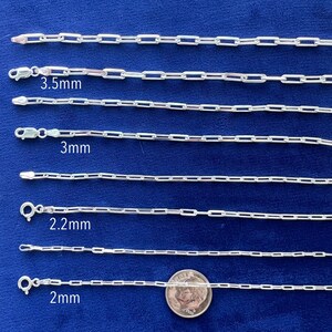 May include: Five silver chains of different sizes, laid out on a blue background. The chains are labeled with their size in millimeters: 3.5mm, 3mm, 2.2mm, and 2mm. A US quarter is included for scale.