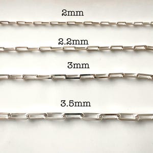 May include: Four silver chains of different sizes, labeled 2mm, 2.2mm, 3mm, and 3.5mm.