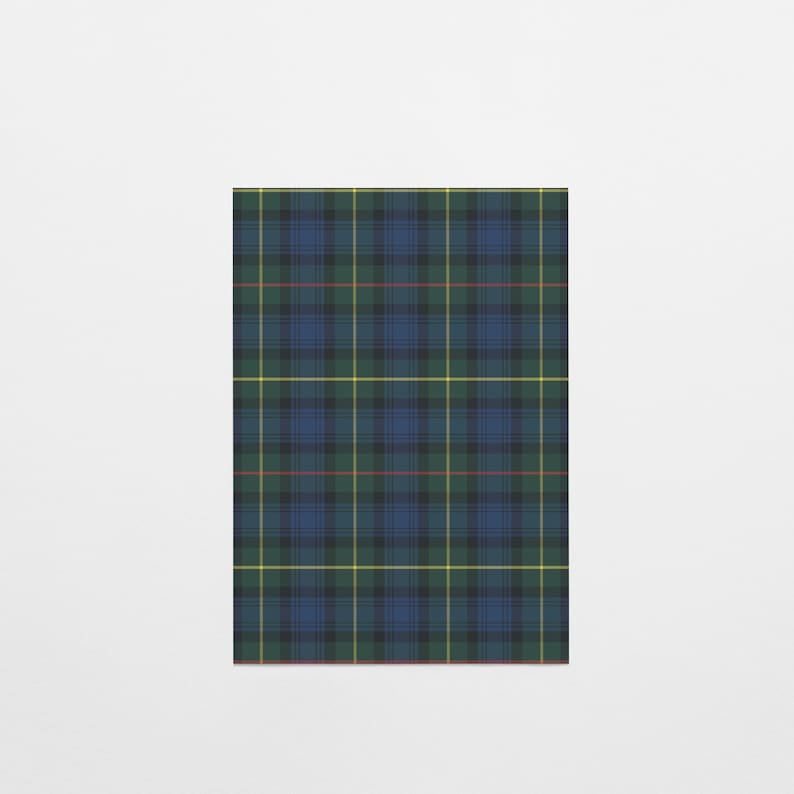 May include: A rectangular textile displaying a traditional tartan pattern. The design is a grid of intersecting lines in blue, green, yellow, and red on a dark base. The pattern is symmetrical and evenly spaced, a classic design.