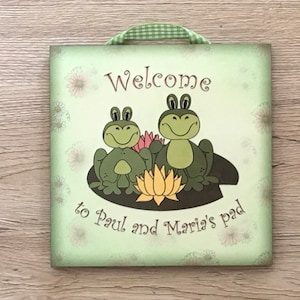 Welcome to our Pad Door Sign: Add your own name to our frog wood or metal daisy plaques or house signs