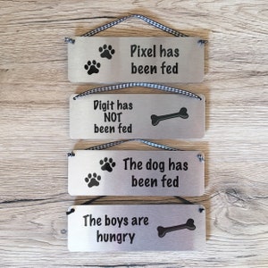 The Dog has been Fed Reminder: Personalised Reversible Aluminium Door or Wall Plaque