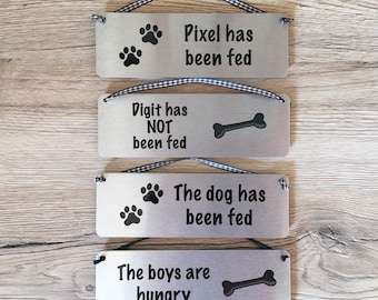 The Dog has been Fed Reminder: Personalised Reversible Aluminium Door or Wall Plaque