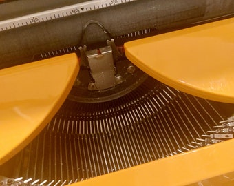 Typewriter from the 70ies, Olympia Germany in Orange