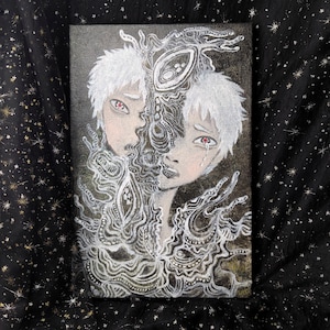 May include: A canvas painting shows two figures with white hair and red eyes, divided by a detailed white, organic pattern. One figure has a tear. The artwork is set against a dark background with a starry pattern.