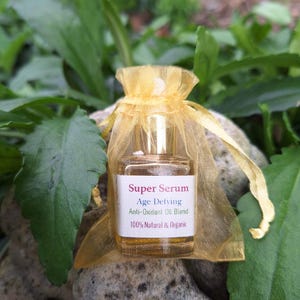 May include: A small bottle of Super Serum Age Defying Anti-Oxidant Oil Blend, 100% Natural & Organic, in a yellow organza bag.