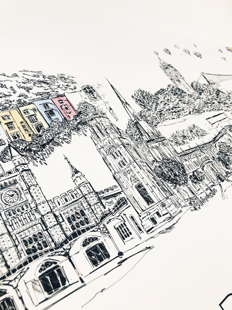 May include: Black and white ink drawing of a city skyline with a church, buildings, and trees. The drawing is done in a minimalist style and features a few colorful accents.