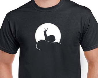 Howling Snail T-shirt. Cute, slimy creature baying at the moon. Black tshirt in a lady's missy cut or men's/unisex cuts.