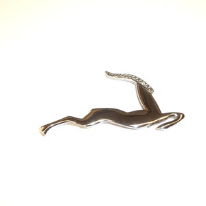 Vintage Sleek Bright Silvertone Gazelle Brooch with Rhinestone Eye
