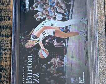 May include: A sports trading card featuring Veronica Burton, number 22, in a white uniform dribbling a basketball. The card includes the text 'RYAN FORS', 'VERONICA BURTON 22', and 'GUARD 5' 9" Northwestern'. The card is encased in a clear plastic sleeve.