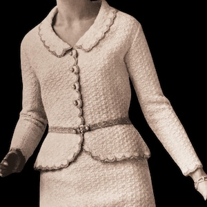 May include: A vintage cream-colored skirt suit. The jacket has a scalloped collar and hem, with decorative buttons and a matching belt. The skirt is a straight, knee-length style. The suit is made of a textured fabric.