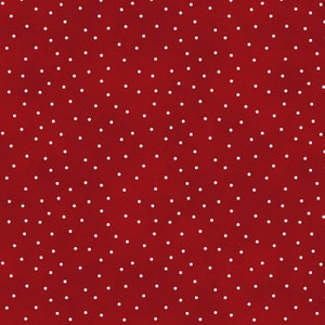 Peut inclure: Un fond rouge foncé orné d'un motif de petits pois blancs. Les pois sont dispersés sur la surface, créant un design classique et ludique. La palette de couleurs est simple et audacieuse.