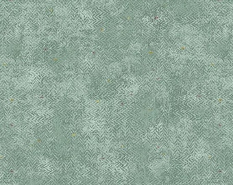 May include: A fabric with a muted green hue and a textured surface, featuring a subtle herringbone design. Small specks of yellow and red are scattered across the material. The fabric has a vintage or rustic appearance.