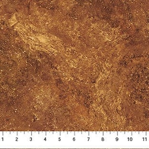 Könnte beinhalten: Nahaufnahme einer braunen, strukturierten Oberfläche mit einem Lineal am unteren Rand. Das Lineal misst bis zu 30 cm. Die Oberfläche hat ein marmoriertes Aussehen mit verschiedenen Braun- und Beigetönen, die an Stein oder Erde erinnern.