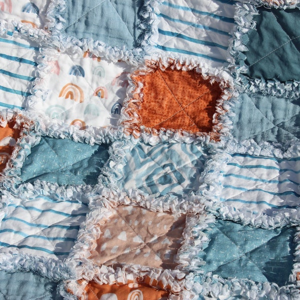 Crib size baby rag quilt, Blue, Rust, and White print fabrics from Spoonflower; 33" x 49", baby quilt