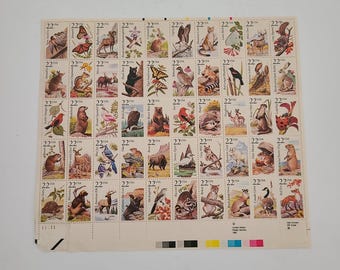 Vintage 1987 full sheet of .22ct United States Postal Service American Wildlife, there is tear to the bottom left border no effect to stamps